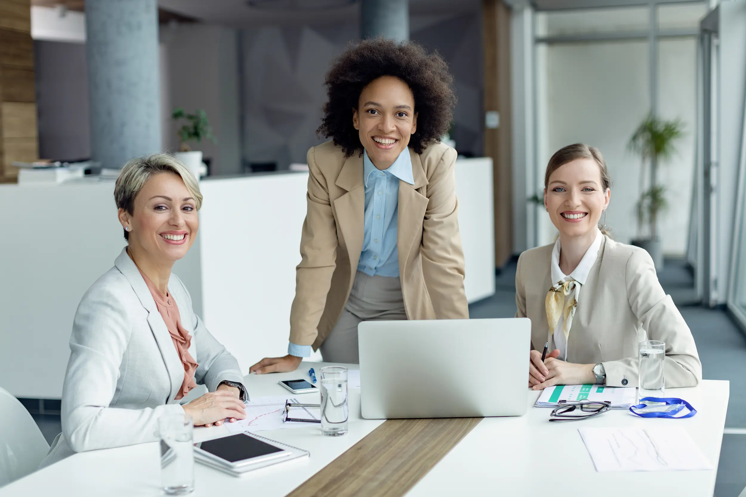 team happy businesswomen working office looking camera